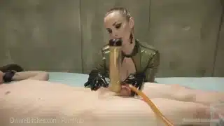 Latex Dominatrix Milks Slave Boy