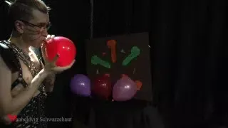 Nicky as a superhero destroys balloons