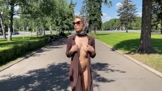 Stylish Lady walks naked in park. Public.