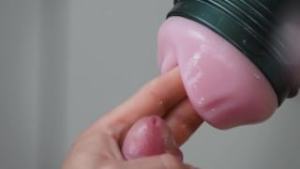 Extreme close up of cock in slow motion with Fleshlight and finished by cumshot