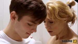 SHAME4K. Perv jerks off peeping on MILF in bathroom and she catches him