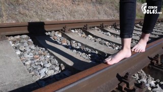 Barefoot walking and dirty feet on rails (long toes, bare feet, foot tease, sexy feet, public feet)
